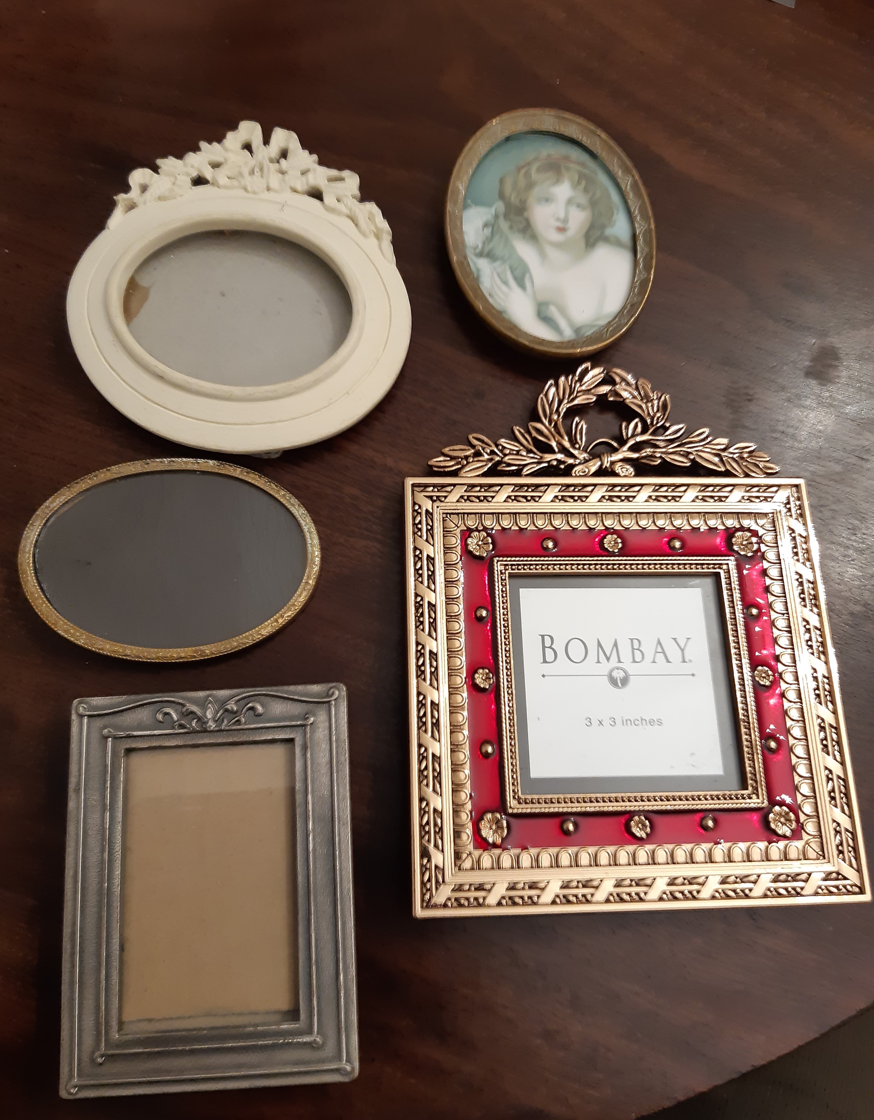 Small pewter photograph frame and four other decorative frames