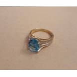 9ct gold blue topaz solitaire ring, approx 2ct, shank with diamond set shoulders, ring size M