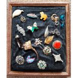 Two framed displays of vintage brooches, including enamelled, paste and agate examples