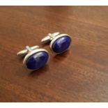 Pair white metal and lapis lazuli cufflinks, with oval cabochon faces