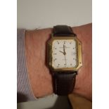Gents Baume & Mercier Geneve Tank quartz wristwatch with date function, 35mm gold coloured metal and