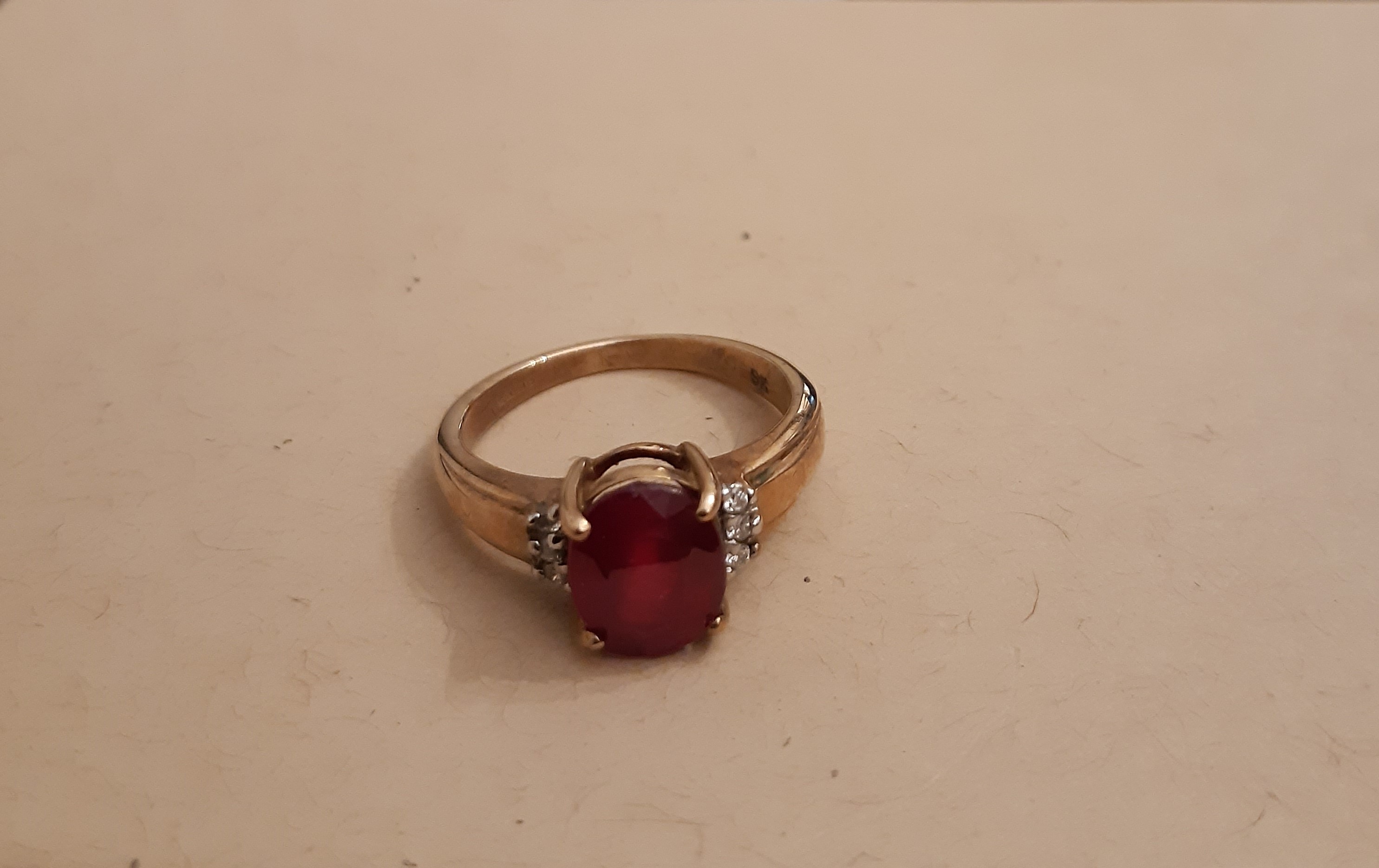 9ct gold, ruby and diamond ring, central ruby approx 1ct, ring size L