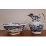 Early 19th Century 'Genevese' blue and white pottery wash jug and basin, jug 29cm high (damaged),