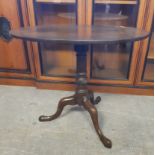 George III mahogany oval tripod table, central central column with wrythen knop, cabriole legs, 86cm