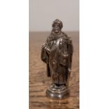 White metal desk seal, modelled as 'Lawrence of Arabia', armorial engraved matrix, 5.5cm high