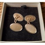 Pair of 9ct gold oval cufflinks, engraved faces with silvered rims, 7.7 grams