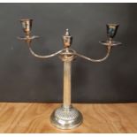 Late 19th Century plated twin sconce candlebra, central finial with figural armorial, 40cm high