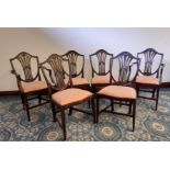 Set of six 1920's mahogany dining chairs (including two armchairs) of Hepplewhite design, shield