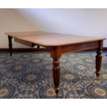 Victorian mahogany extending 'Push-Pull' dining table, with two extra leaves, on turned and reeded