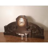 German Art Deco bronzed spelter mantel timepiece, with engine turned star burst dial, the case