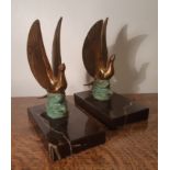 Pair French Art Deco gilded and cold painted metal Dove paperweights, with veined black marble