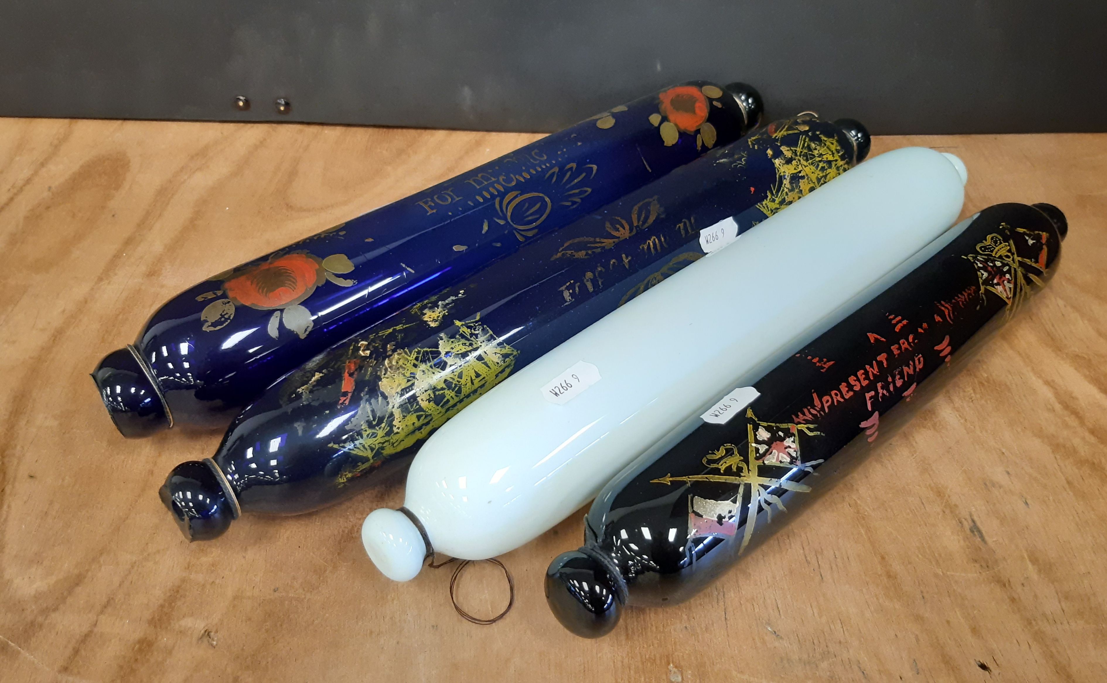 Four 19th Century Sailor's glass rolling pins, variously decorated, opaque white glass example