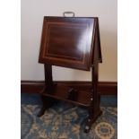 Edwardian satinwood banded and inlaid mahogany magazine stand, the book trough base with slide, 43cm