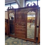 Edwardian mahogany Compactum wardrobe, central drawers and hanging space flanked by shaped and