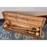 Vintage Atlas Croquet set, complete with four mallets, four hoops and four balls, stencilled pine