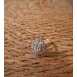 18ct gold and platinum mounted all diamond Flowerhead ring, central oval stone approx 1.5ct,