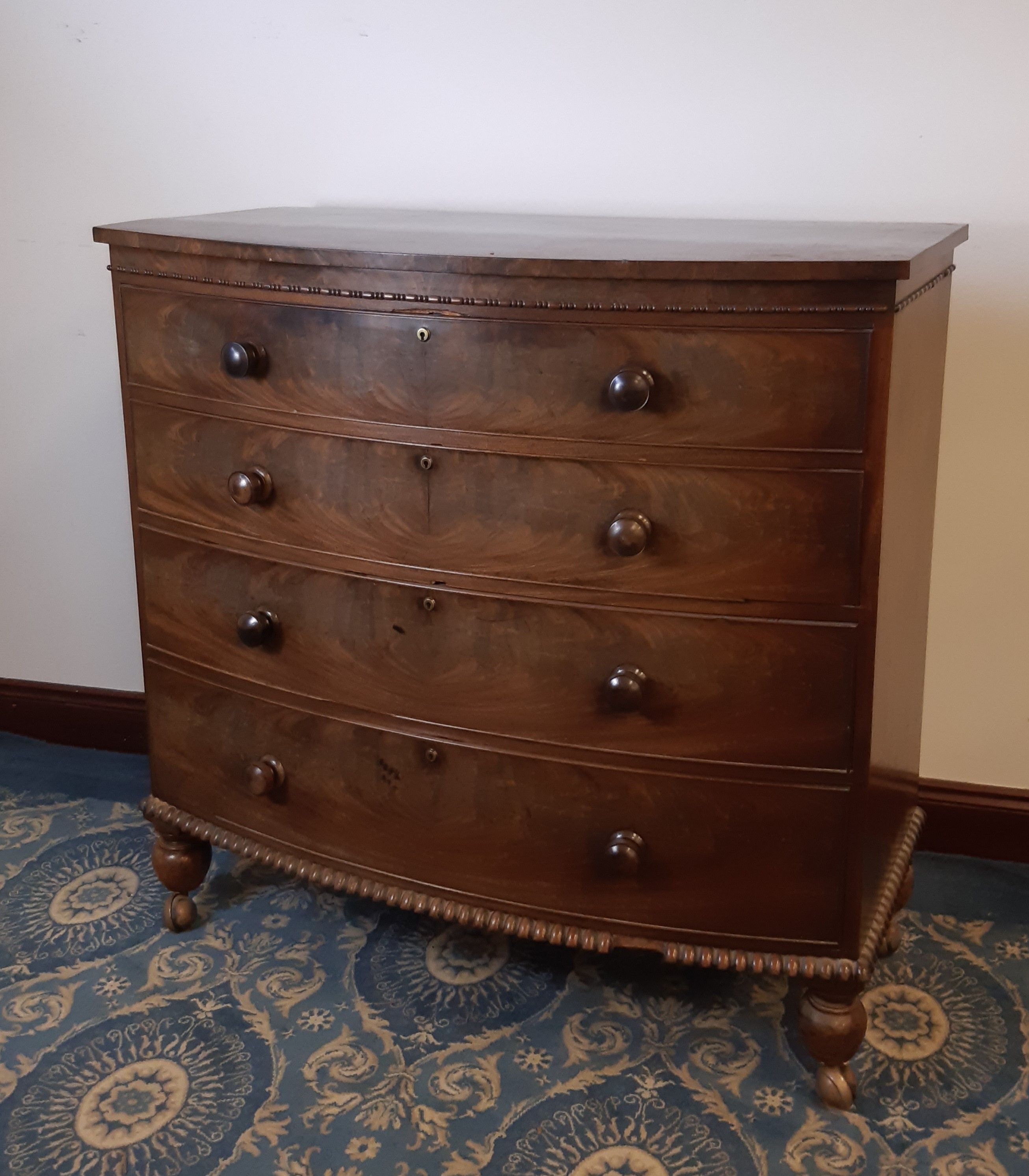 Early Victorian figured mahogany bow front chest of drawers, Bramah locks, bead mouldings on