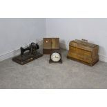 An antique German sewing machine, a walnut cased sewing machine, a smiths mantel clock and a