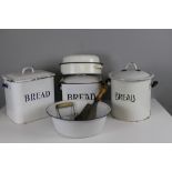 Three vintage enamel bread bins, casserole dish, mixing bowl, wooden handled cleaver and herb