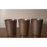 Three early 20th Century Kut Hing Swatow pewter shot beakers, each 5.5cm high