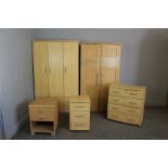 Five items of modern laminate bedroom furniture, comprising two wardrobes, 2/3 chest of drawers