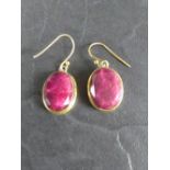 A pair of gilt metal and ruby/red stone earrings 2cm