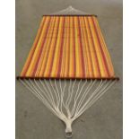 A large hammock, with striped material 116cm x 234cm