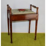 An Edwardian piano stool, of traditional form with turned rails 61cm x 46cm x 33cm