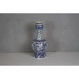 A Delft pottery vase decorated with stylised birds and foliage 40cm high painted marks to base
