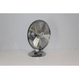 A modern 'Micromark' chrome effect desk fan 41cm x 34cm