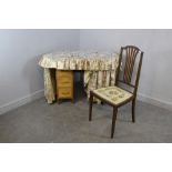 A 1930's beechwood dressing table, of kidney shape with floral material drapes 73cm x 103cm x 50cm