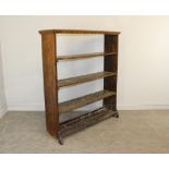 A Victorian rosewood veneered open bookcase with moulded top and four selves, some worm damage 150cm