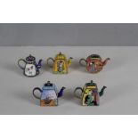 A group of five 'Trade and Aid' miniature enamel teapots, decorated with the works of Picasso,