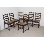 A set of six elm ladder back chairs by Hallmark Foster-binder (label to underside) the padded