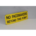 A painted metal 'No Pacemakers Beyond This Point' sign 20cm x 60cm