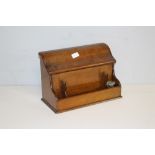 A late Victorian mahogany desk stand, with shaped and hinged lift-up top enclosing stationary