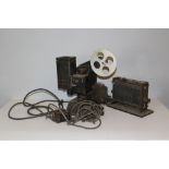 An Eastman Kodak Company Kodascope projector, with photo switch and two movie reels Charlie