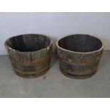 Two half barrel planters with iron bands 43cm x 65cm