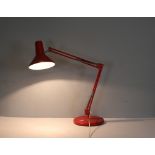 A Danish 'Maxam type 85-4' angle-poise lamp, in red with some flaking and corrosion