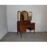 Edwardian Mahogany Dressing Table with quarter veneers and inlaid banding, arched triple bevelled