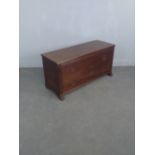 A modern mahogany plank coffer, the oblong top with piano hinge enclosing the internal storage and