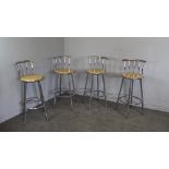 A set of four modern chrome bar stools with beech effect insert seats 96cm high