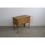 A modern pine three-drawer side table 75cm x 92cm x 44cm