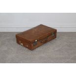 A vintage brown leather suitcase, with mustard coloured material lining 17cm x 54cm x 35cm