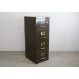 A vintage four-drawer metal filing cabinet 132cm x 47cm x 61.5cm used condition with some knocks and