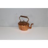 A 19th century copper kettle, of generous proportions with over handle and gadrooned cover 28cm x