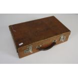 A small vintage brown leather suitcase 40.5cm wide