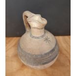 Roman pottery jug, decorated with brown banding and star, 17cm high, minor decoration loss