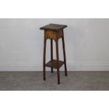 An Edwardian oak jardiniere stand 79cm x 28cm