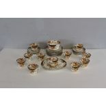 A 19th century porcelain tea set, decorated in The Crown Derby style and palette, gilt numbers 399/4